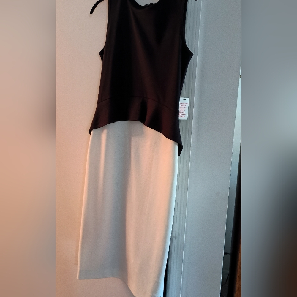 Chic Black and White ponte  Dress with peplum by waist.